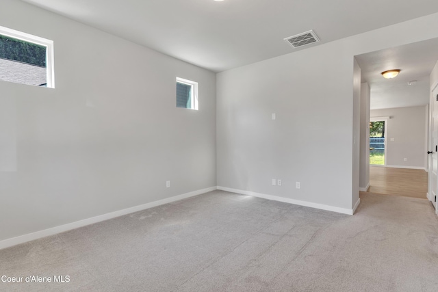 161 White Way, Priest River, ID 83856 - spare room featuring plenty of natural light, baseboards, and light carpet