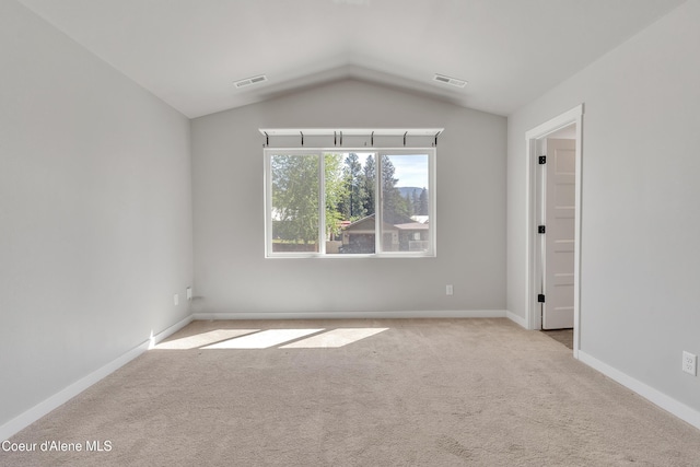 161 White Way, Priest River, ID 83856 - carpeted spare room with lofted ceiling and baseboards