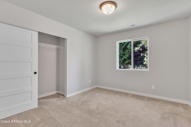 161 White Way, Priest River, ID 83856 - unfurnished bedroom featuring carpet flooring, baseboards, and a closet