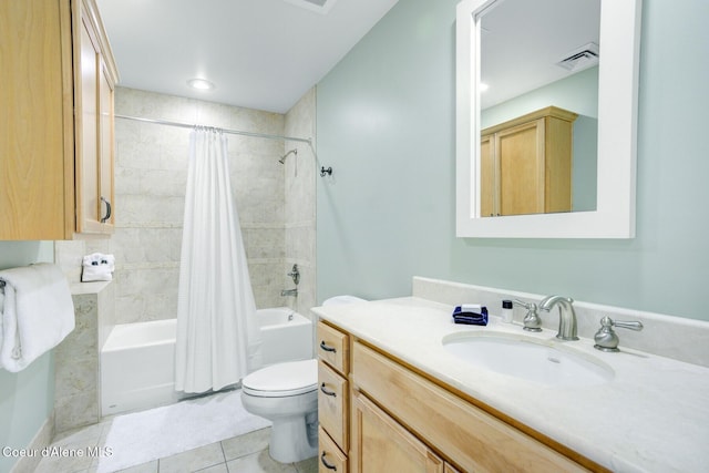 bathroom featuring shower / bath combo, tile patterned floors, toilet, and vanity
