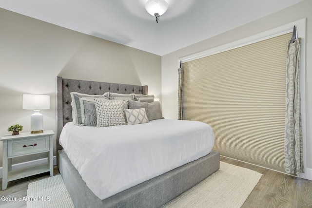 bedroom with wood finished floors