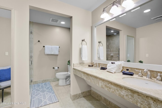 bathroom with a stall shower, toilet, baseboards, tile patterned floors, and double vanity