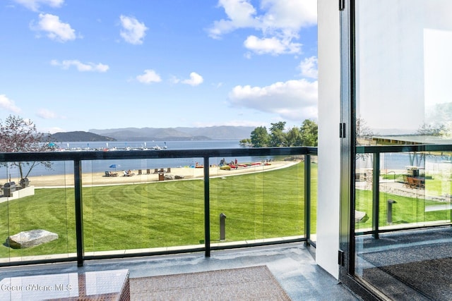 balcony with a water and mountain view