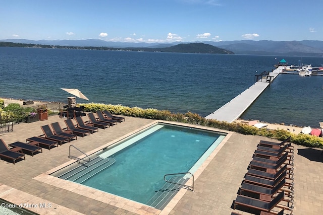 view of pool featuring a water and mountain view