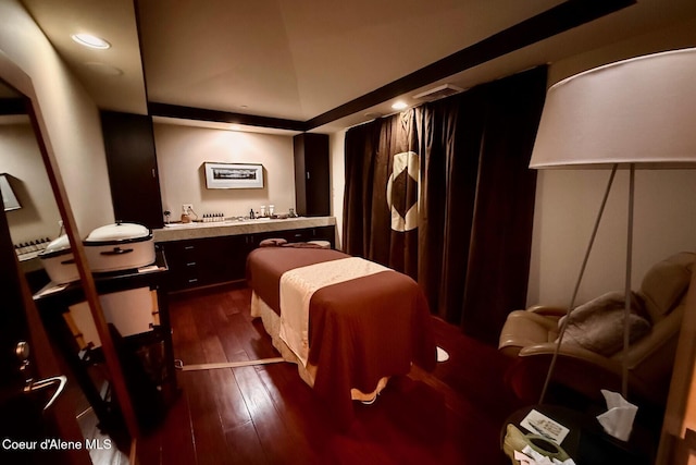 bedroom featuring dark wood-style floors, bar area, and recessed lighting