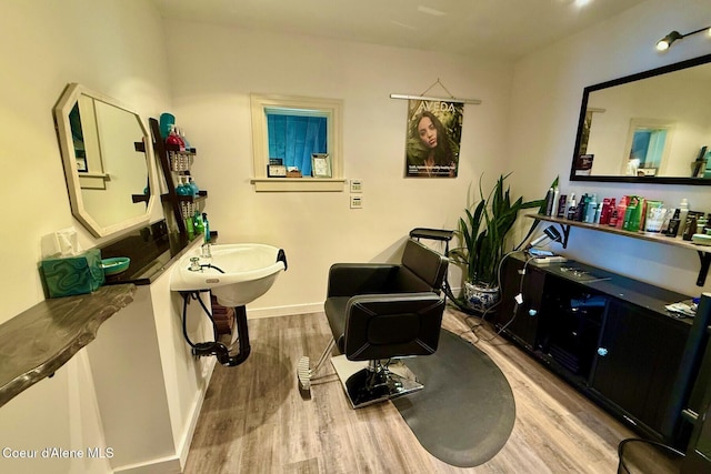 living area featuring wood finished floors and baseboards