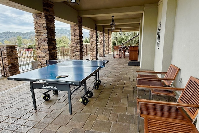 view of patio with a mountain view and outdoor dining area