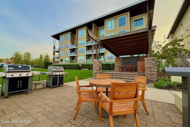 view of patio featuring grilling area and outdoor dining space