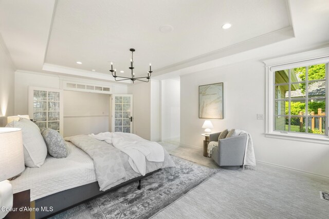 2484 E Woodstone Dr, Hayden, ID 83835 - carpeted bedroom with a tray ceiling, a chandelier, crown molding, baseboards, and recessed lighting