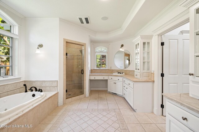 2484 E Woodstone Dr, Hayden, ID 83835 - bathroom featuring tile patterned floors, a shower stall, vanity, a whirlpool tub, and crown molding