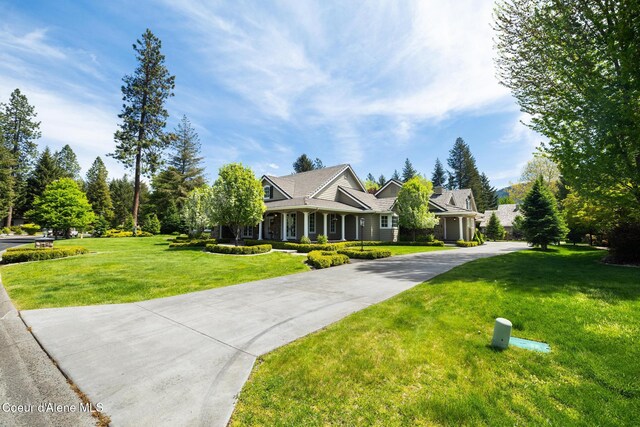 2484 E Woodstone Dr, Hayden, ID 83835 - view of front of home featuring a front lawn and concrete driveway