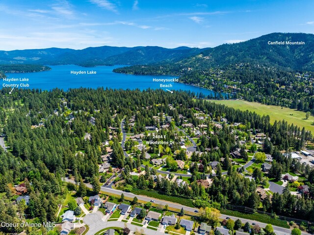 2484 E Woodstone Dr, Hayden, ID 83835 - bird's eye view of a water and mountain view and a forest