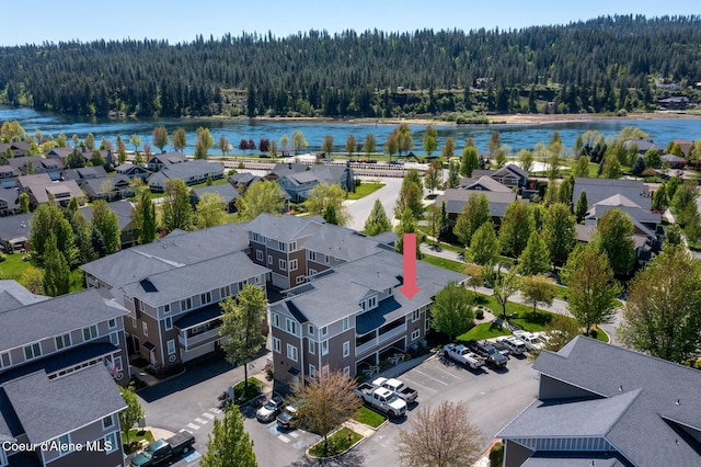 4445 W Greenchain Loop Unit 2, Coeur Dalene, ID 83814 - aerial view of residential area featuring a forest and a nearby body of water