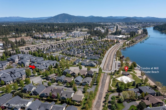 4445 W Greenchain Loop Unit 2, Coeur Dalene, ID 83814 - aerial view of property's location with nearby suburban area and a water and mountain view