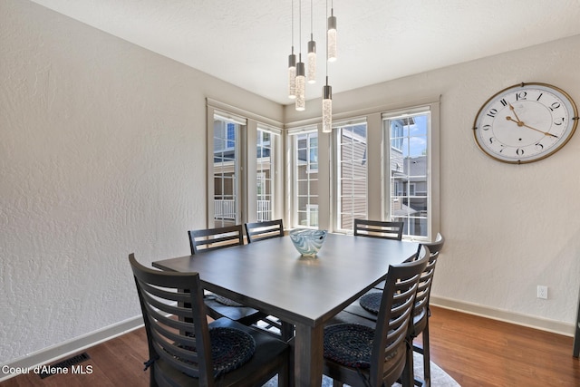 4445 W Greenchain Loop Unit 2, Coeur Dalene, ID 83814 - dining space featuring baseboards, wood finished floors, and a textured wall