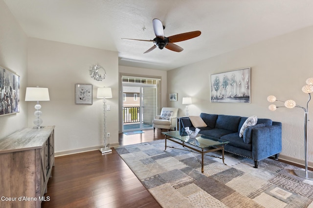 4445 W Greenchain Loop Unit 2, Coeur Dalene, ID 83814 - living area with ceiling fan, dark wood-type flooring, and baseboards