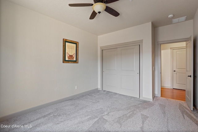 4445 W Greenchain Loop Unit 2, Coeur Dalene, ID 83814 - unfurnished bedroom with carpet flooring, baseboards, a closet, and ceiling fan
