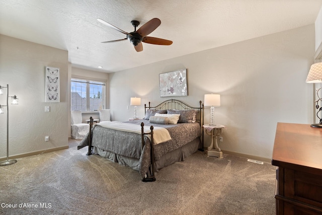 4445 W Greenchain Loop Unit 2, Coeur Dalene, ID 83814 - carpeted bedroom with baseboards and a ceiling fan