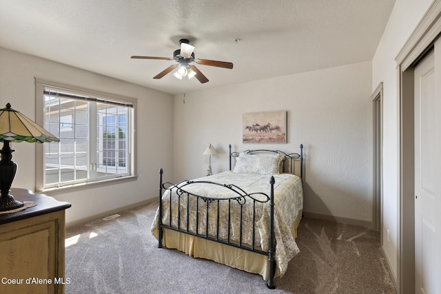 4445 W Greenchain Loop Unit 2, Coeur Dalene, ID 83814 - bedroom with carpet flooring, baseboards, and a ceiling fan
