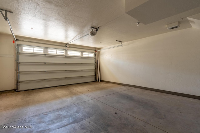 4445 W Greenchain Loop Unit 2, Coeur Dalene, ID 83814 - garage featuring baseboards