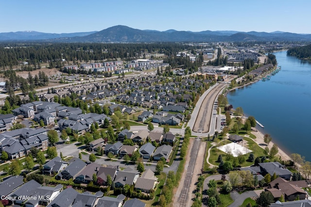 4445 W Greenchain Loop Unit 2, Coeur Dalene, ID 83814 - aerial view of property and surrounding area featuring nearby suburban area and a water and mountain view
