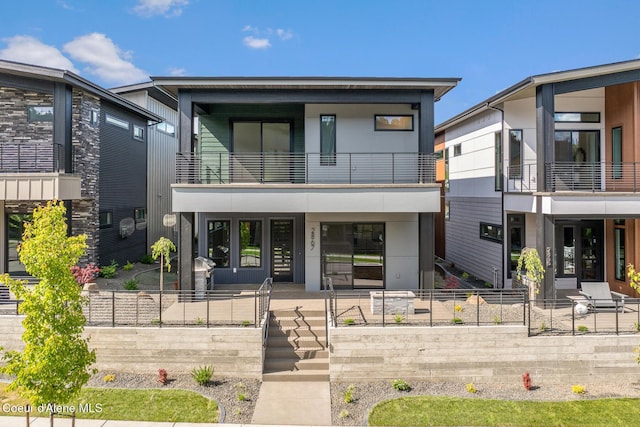 2867 W Lumber Ln, Coeur Dalene, ID 83814 - modern home featuring a balcony and a porch