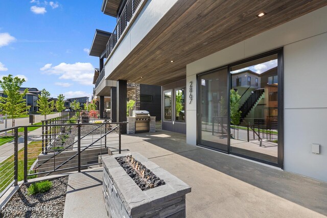 2867 W Lumber Ln, Coeur Dalene, ID 83814 - view of patio / terrace featuring an outdoor fire pit and area for grilling