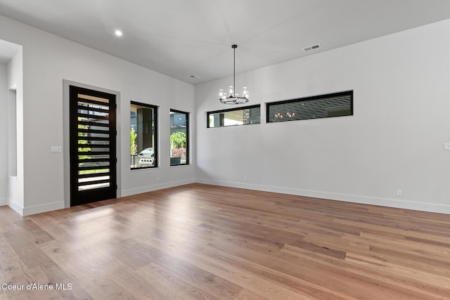 2867 W Lumber Ln, Coeur Dalene, ID 83814 - unfurnished dining area with plenty of natural light, light wood-type flooring, a chandelier, and recessed lighting