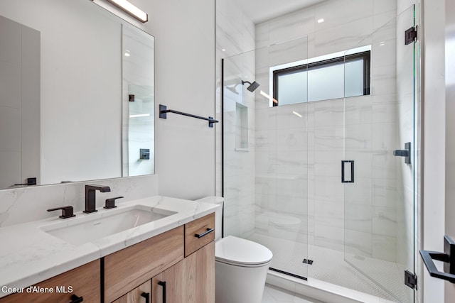 2867 W Lumber Ln, Coeur Dalene, ID 83814 - bathroom with vanity, toilet, and a shower stall
