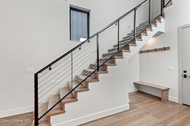 2867 W Lumber Ln, Coeur Dalene, ID 83814 - staircase featuring baseboards and wood finished floors