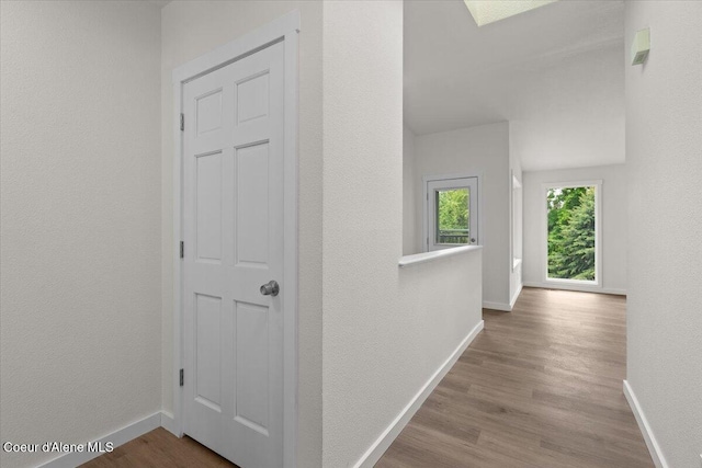 1303 N Cherrywood Dr, Coeur Dalene, ID 83814 - hall featuring baseboards, wood finished floors, and a textured wall