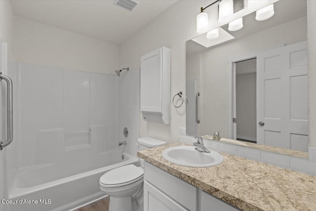1303 N Cherrywood Dr, Coeur Dalene, ID 83814 - bathroom featuring vanity, toilet, bathing tub / shower combination, and wood finished floors