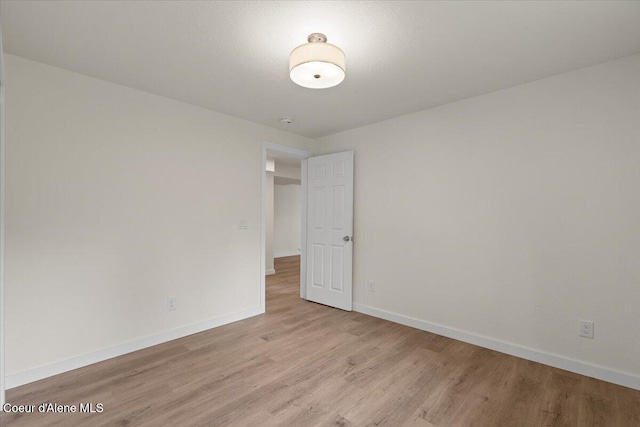 1303 N Cherrywood Dr, Coeur Dalene, ID 83814 - spare room with light wood finished floors and baseboards