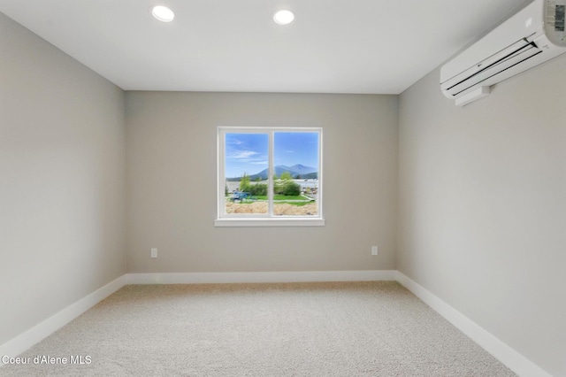 1678 Onyx Ct, Sandpoint, ID 83864 - empty room with a wall unit AC, light colored carpet, recessed lighting, and baseboards