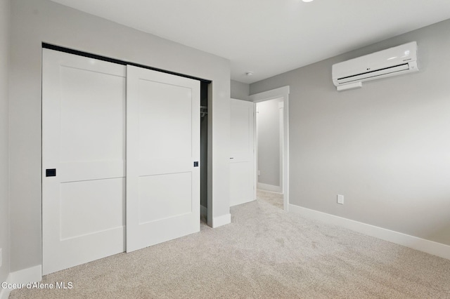 1678 Onyx Ct, Sandpoint, ID 83864 - unfurnished bedroom with a wall mounted AC, carpet, a closet, and baseboards