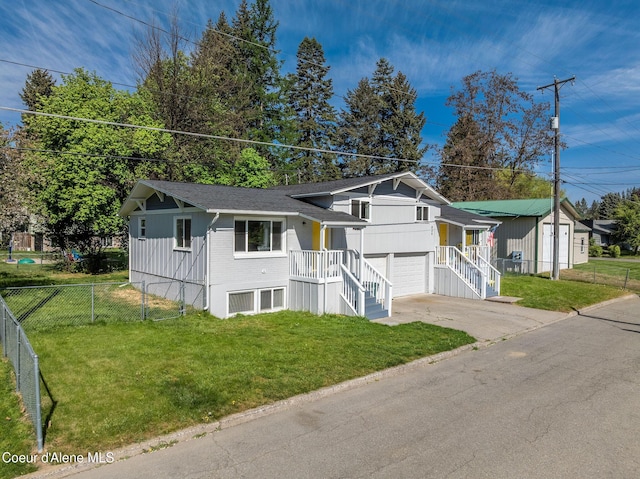 837 N 19th St, Coeur Dalene, ID 83814 - tri-level home featuring concrete driveway, an attached garage, and a shingled roof