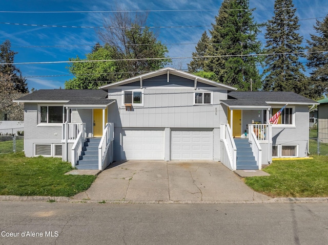 837 N 19th St, Coeur Dalene, ID 83814 - split level home with stairway, a front yard, an attached garage, and concrete driveway
