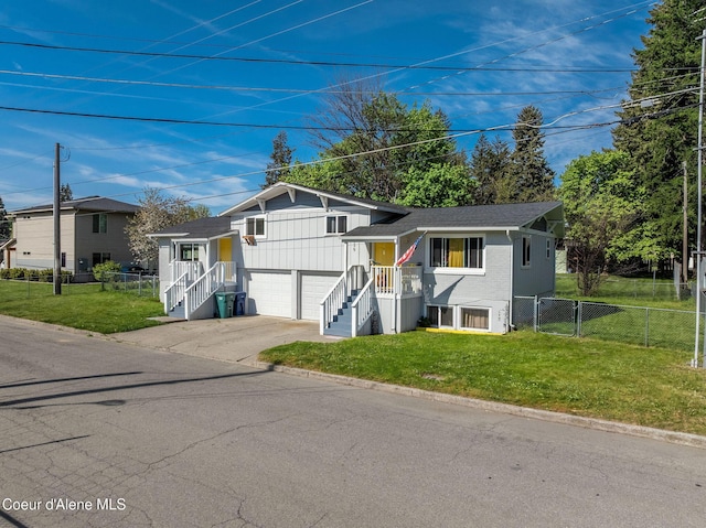 837 N 19th St, Coeur Dalene, ID 83814 - tri-level home featuring concrete driveway, a garage, and a shingled roof