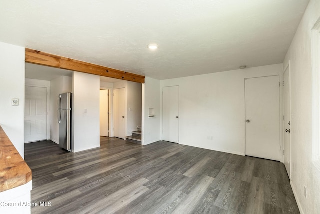 837 N 19th St, Coeur Dalene, ID 83814 - unfurnished room with dark wood-type flooring and stairway