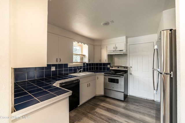 837 N 19th St, Coeur Dalene, ID 83814 - kitchen featuring stainless steel appliances, tile countertops, white cabinets, and tasteful backsplash