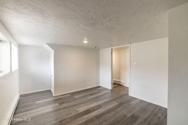 837 N 19th St, Coeur Dalene, ID 83814 - unfurnished room with a textured ceiling, wood finished floors, a baseboard heating unit, baseboards, and a baseboard radiator