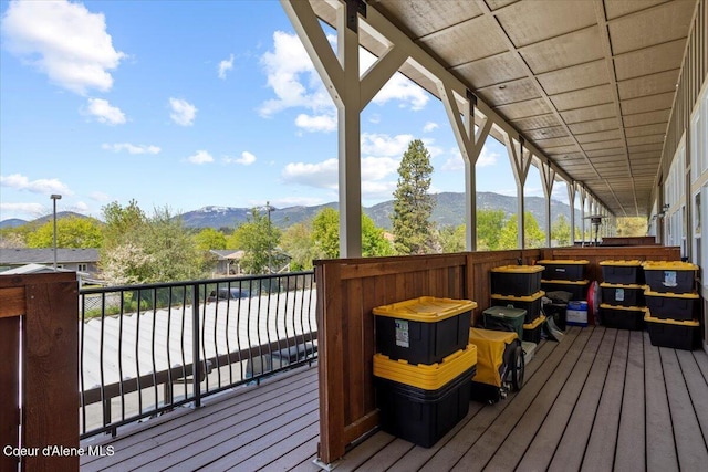 wooden terrace featuring a mountain view
