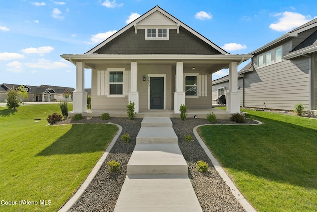 7823 N Girard Cir, Coeur Dalene, ID 83815 - view of front of property with covered porch and a front lawn