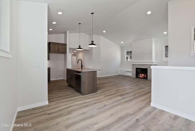 7823 N Girard Cir, Coeur Dalene, ID 83815 - kitchen featuring stainless steel dishwasher, a sink, pendant lighting, light stone counters, and recessed lighting