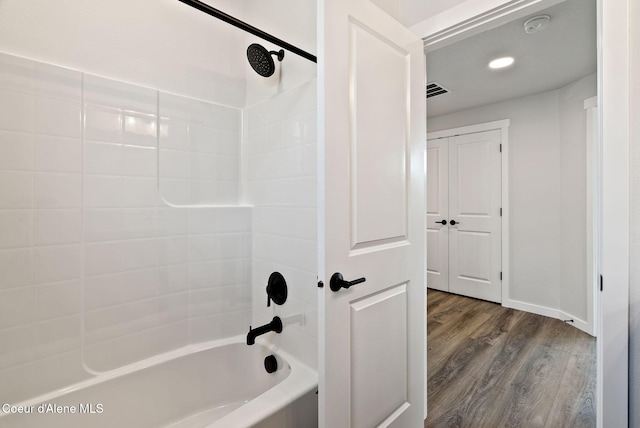 7823 N Girard Cir, Coeur Dalene, ID 83815 - bathroom featuring wood finished floors and tub / shower combination