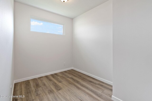 7823 N Girard Cir, Coeur Dalene, ID 83815 - empty room featuring light wood-type flooring and baseboards