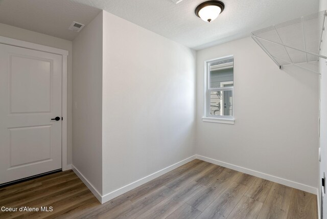 7823 N Girard Cir, Coeur Dalene, ID 83815 - bonus room featuring wood finished floors and baseboards