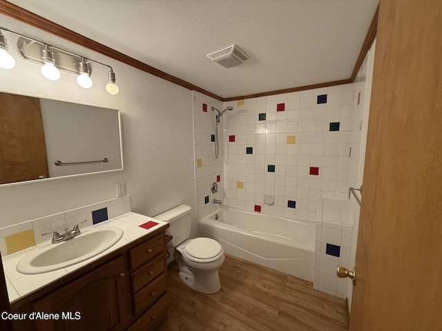 5188 E Woodland Dr, Post Falls, ID 83854 - full bath with wood finished floors, vanity, crown molding, a textured ceiling, and shower / tub combination