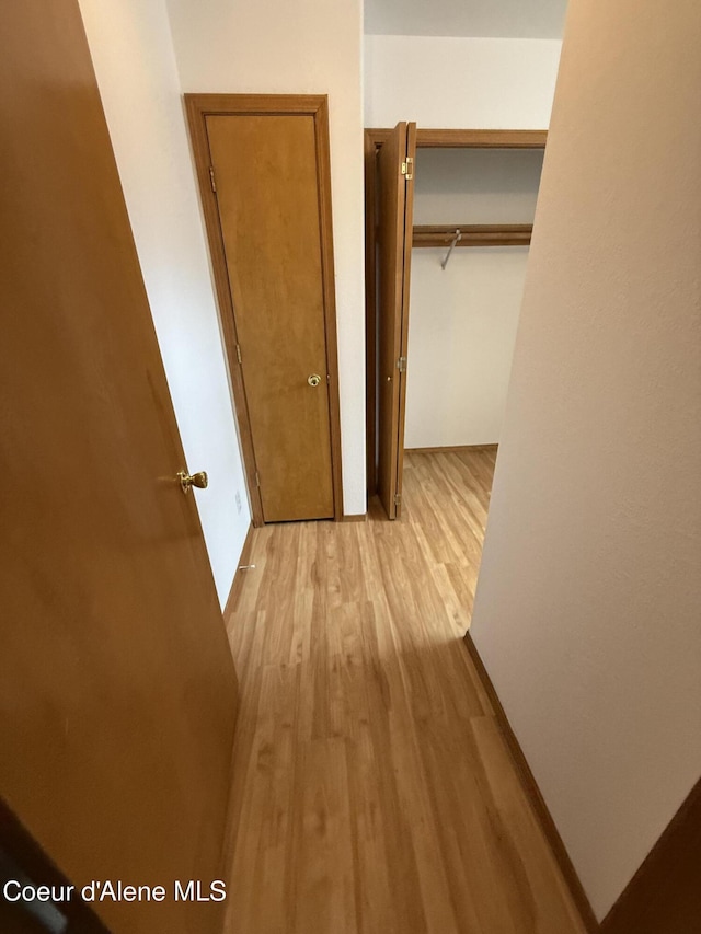 5188 E Woodland Dr, Post Falls, ID 83854 - hallway featuring light wood-type flooring