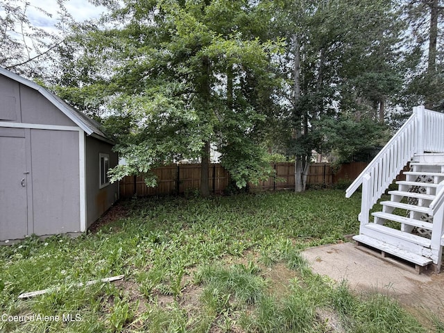 5188 E Woodland Dr, Post Falls, ID 83854 - view of yard featuring stairs and a storage unit